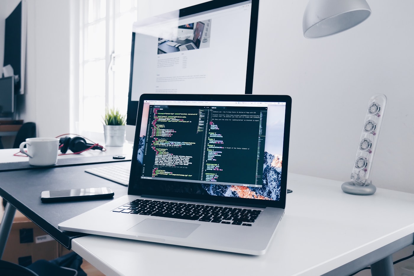 Developer workspace with code on screen